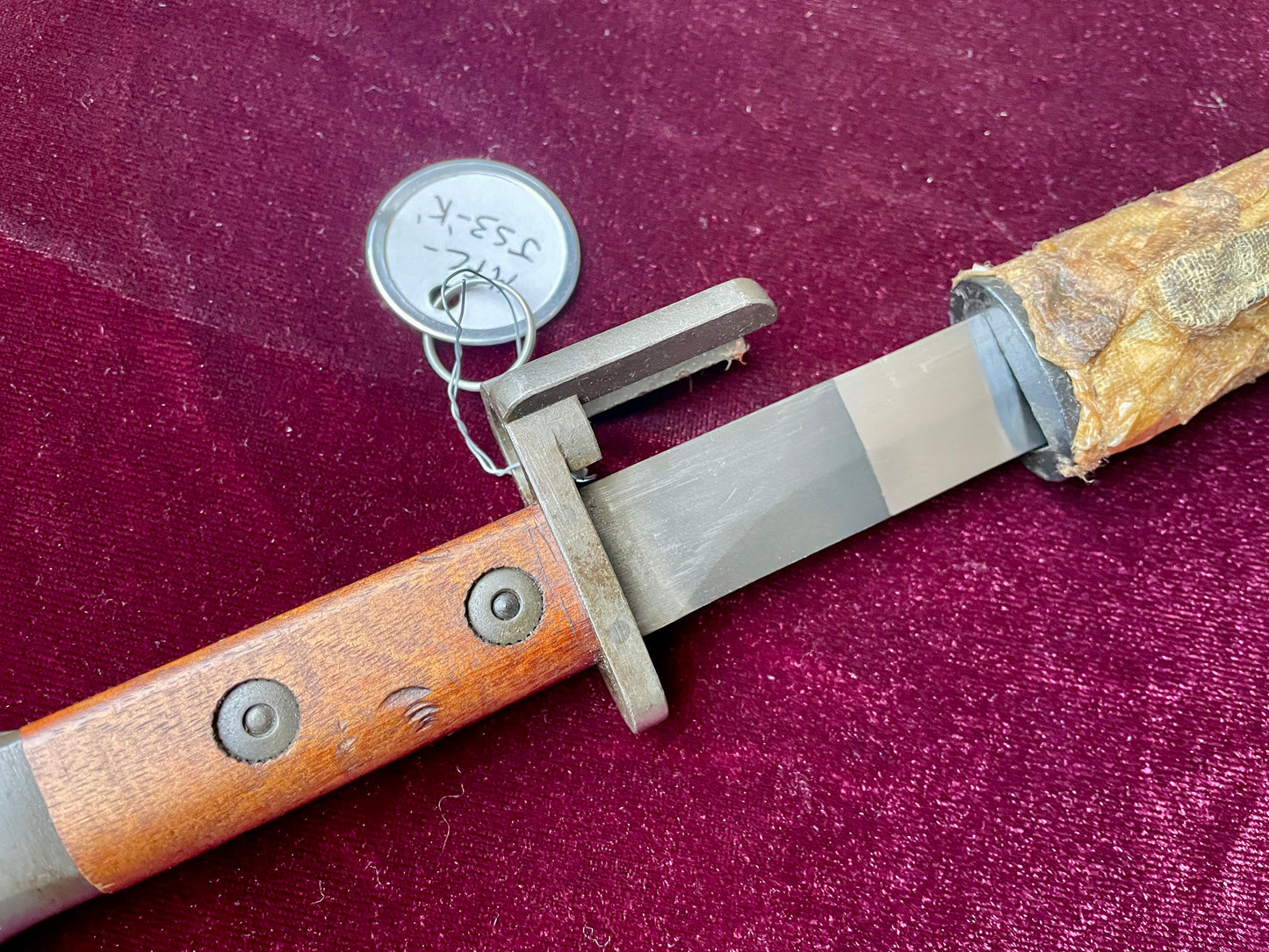 Belgium FN Type A bayonet with wood grips and flash hider prongs.