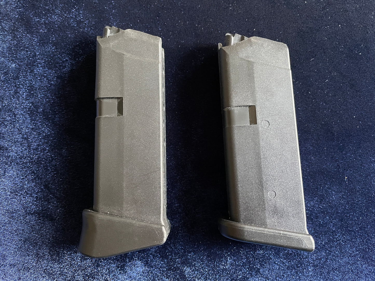 (2) Glock 42 factory mags: 1 finger rest base plate, 1 standard.