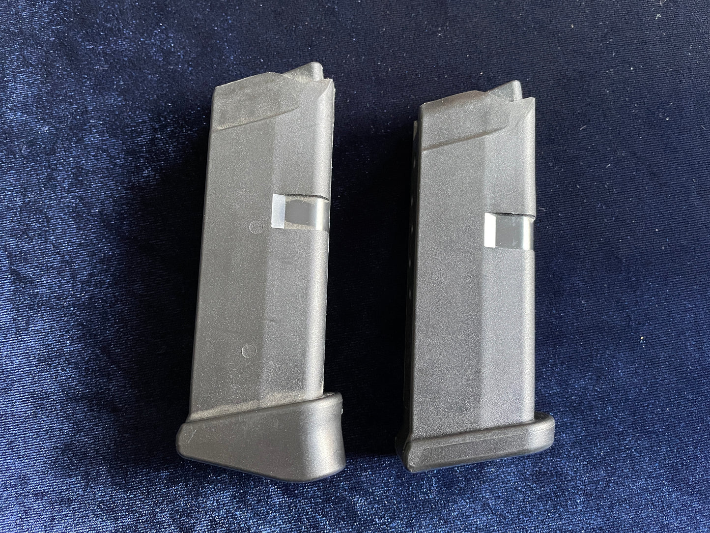 (2) Glock 42 factory mags: 1 finger rest base plate, 1 standard.