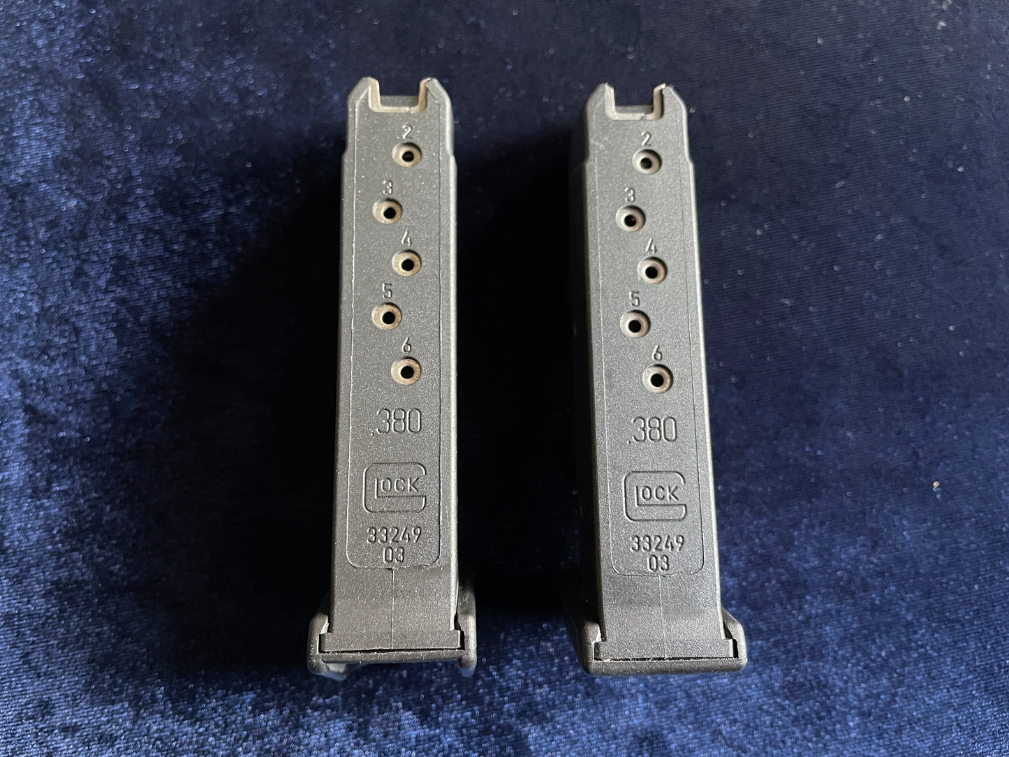 (2) Glock 42 factory mags: 1 finger rest base plate, 1 standard.