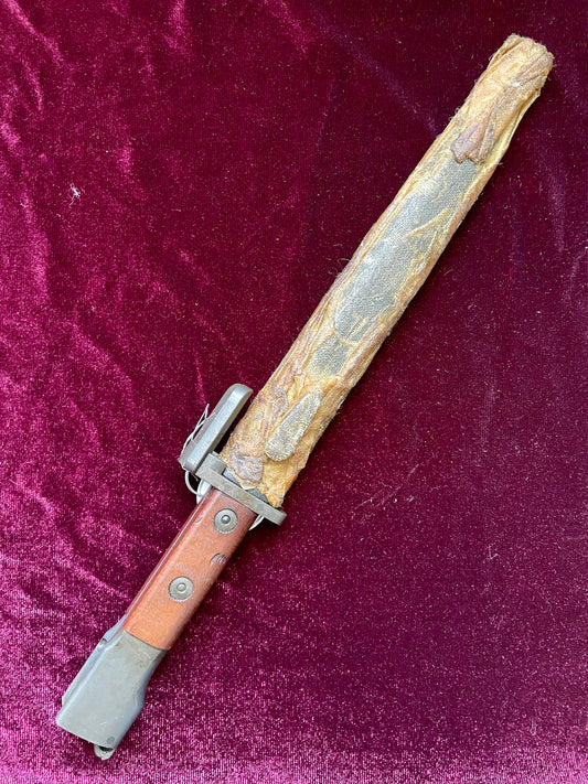 Belgium FN Type A bayonet with wood grips and flash hider prongs.