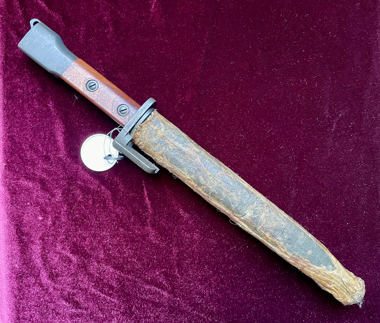 Belgium FN Type A bayonet with wood grips and flash hider prongs.